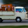 vintage van moving furniture on highway