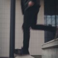 person going down on concrete staircase