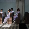 people sitting on church pews