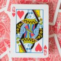 queen card on stack of cards